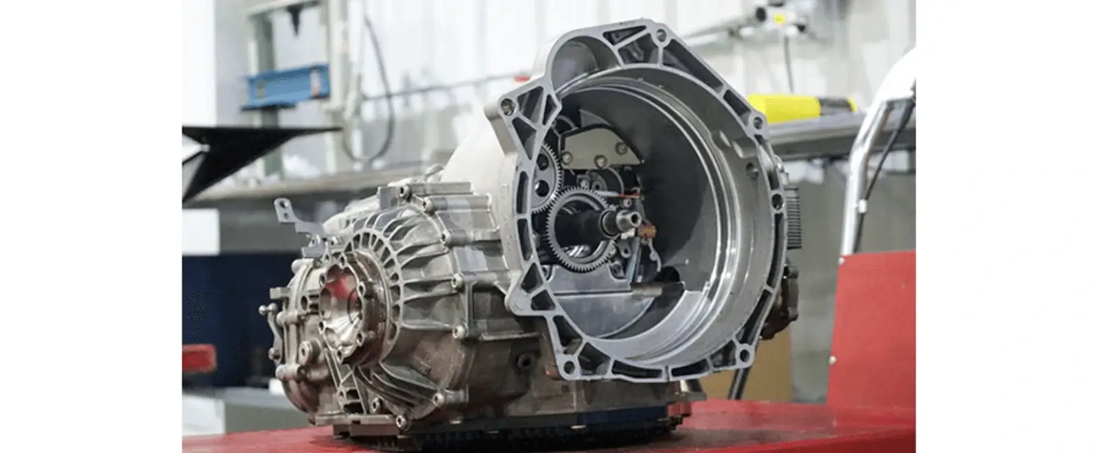 Single PDK transmission unit on the worktable of a Porsche repair shop